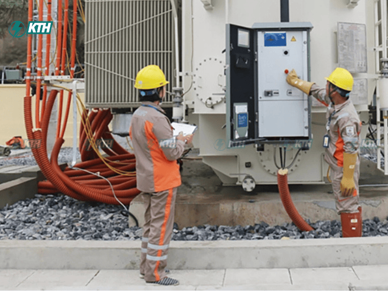 Technician performing transformer oil testing process